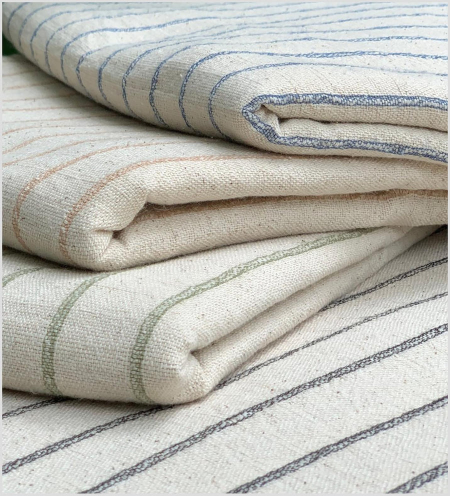 Unbleached 100% cotton fabric off-white, cream color with horizontal woven blue stripes sold by the yard PHA4