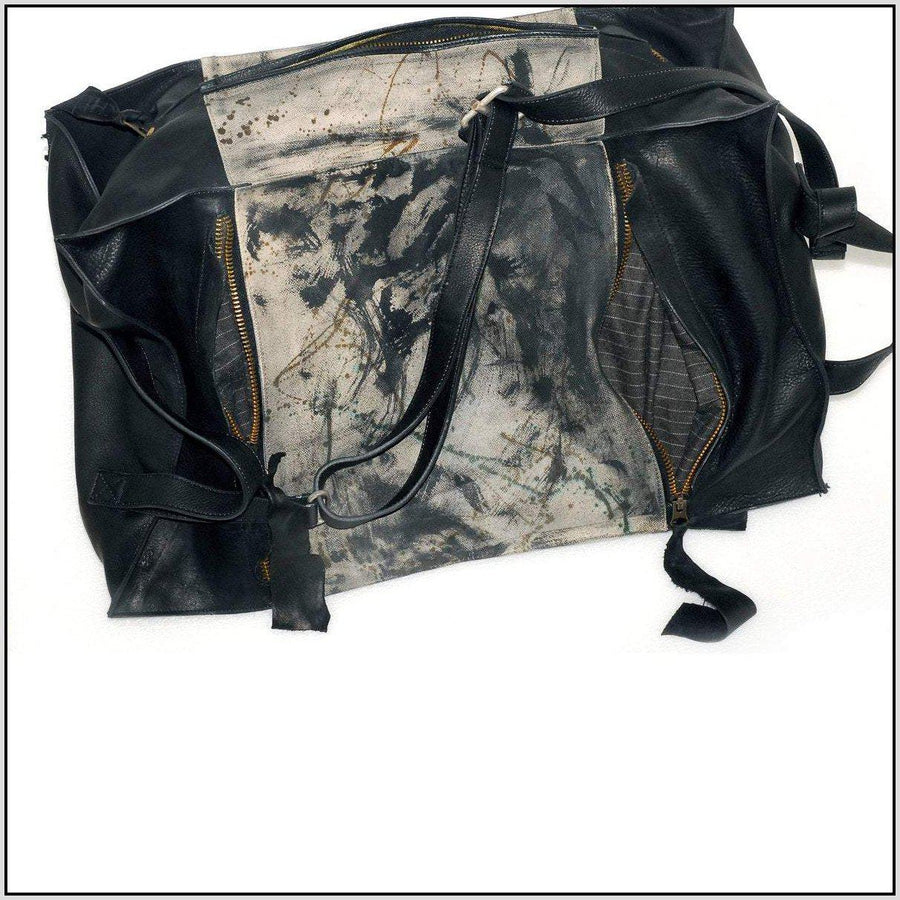 Waxed canvas duffel bag leather cross body bag distressed painted finish with zipper pockets and wool lining. Reperdus.